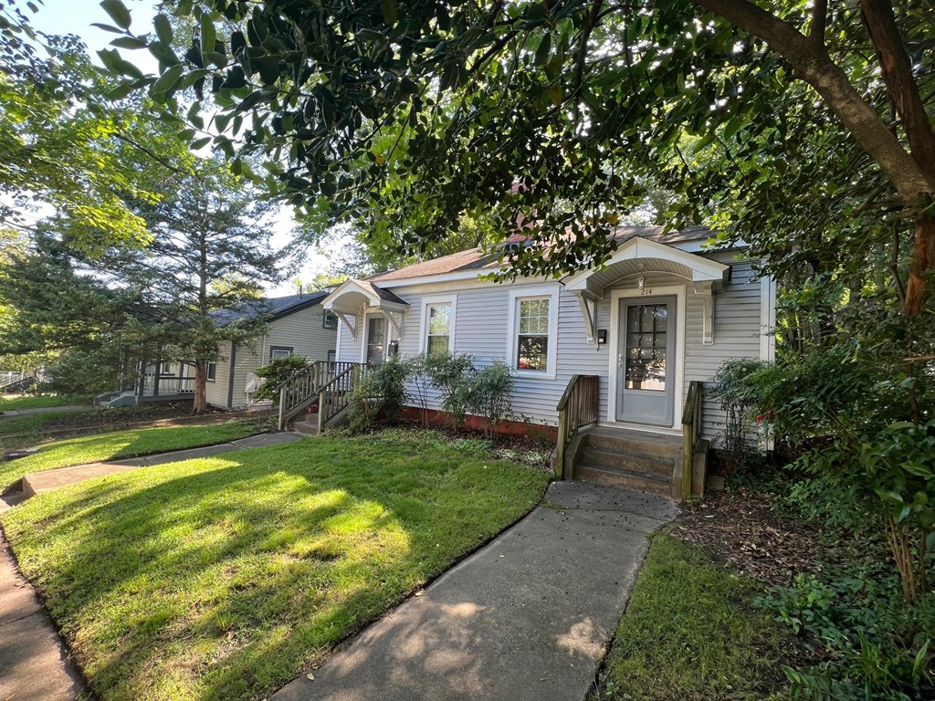 A house with a white door and a small porch.