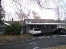 A car is parked in front of a house.