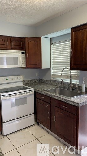 A white ladder is leaning against a wall in a room.