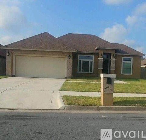 A house with a brown roof and a garage door.