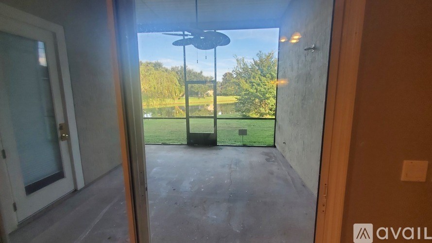 A patio with a table and chairs is visible through a sliding glass door.
