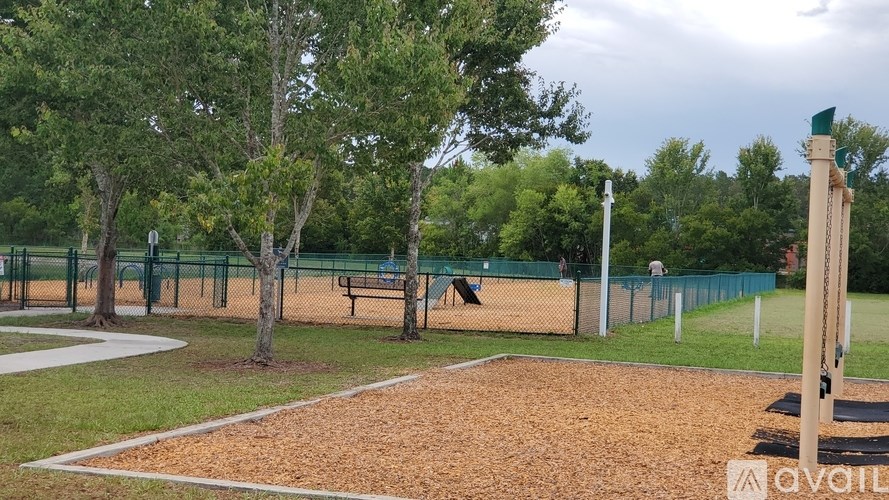 A playground with a swing set and a slide.