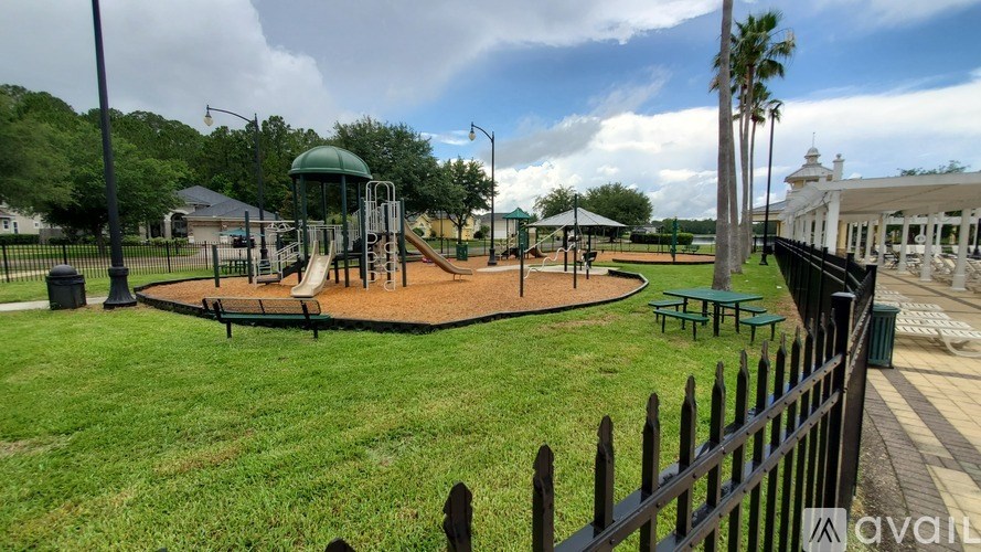 A playground with a swing set and a slide.
