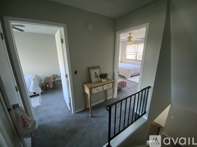 A room with a table and a chair in it.