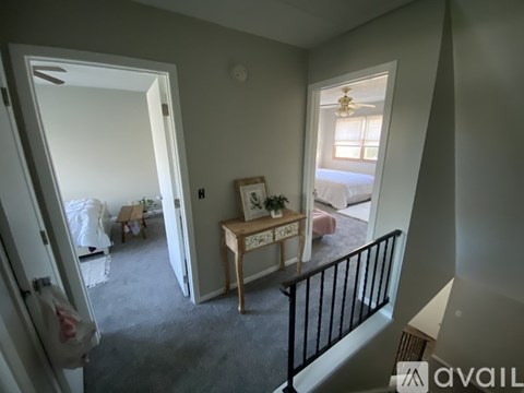 A room with a table and a chair in it.