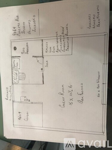 A hand-drawn floor plan of a room with labeled furniture and measurements.