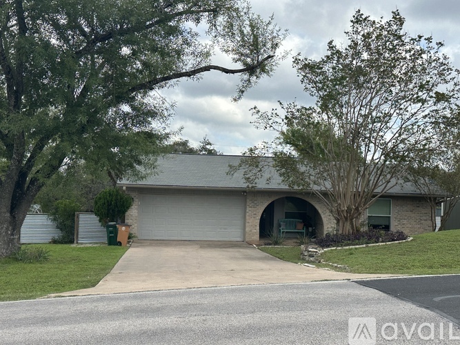A house with a garage is for sale.
