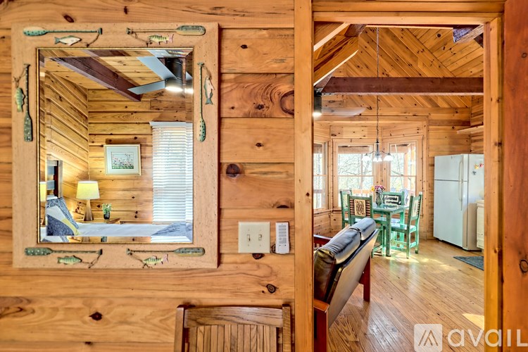 A wooden cabin with a mirror on the wall.