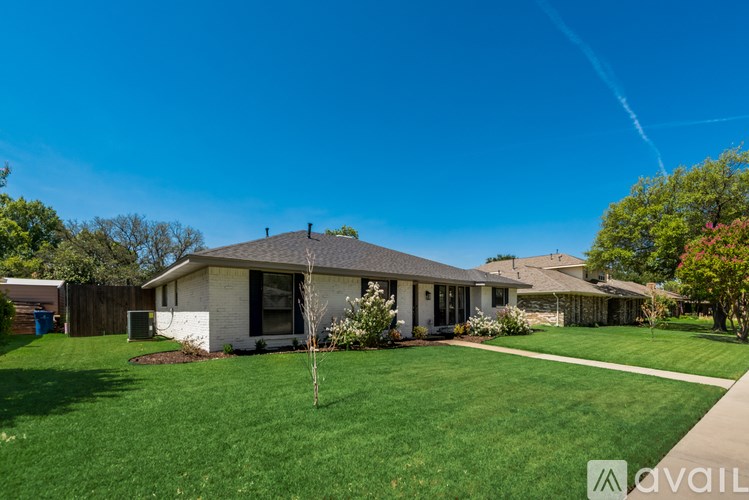A house with a lawn in front of it is for sale.