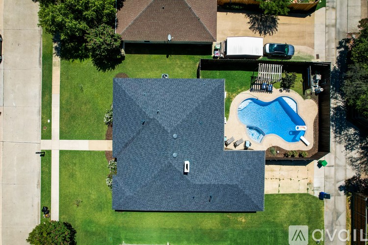 A house with a pool in the backyard.