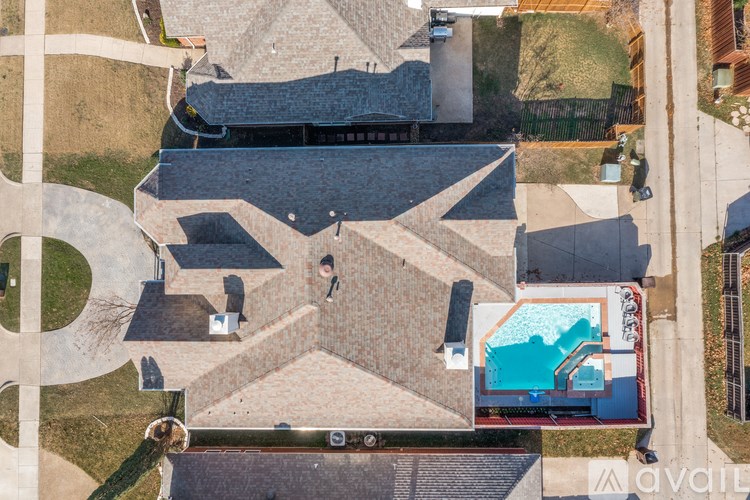 A swimming pool is located in the middle of a courtyard.