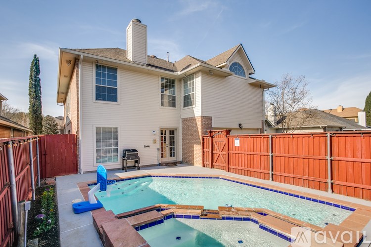 A house with a pool in the backyard.