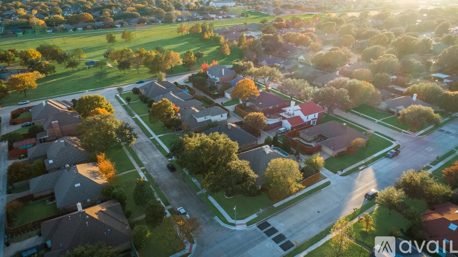 A suburban neighborhood with houses and trees.