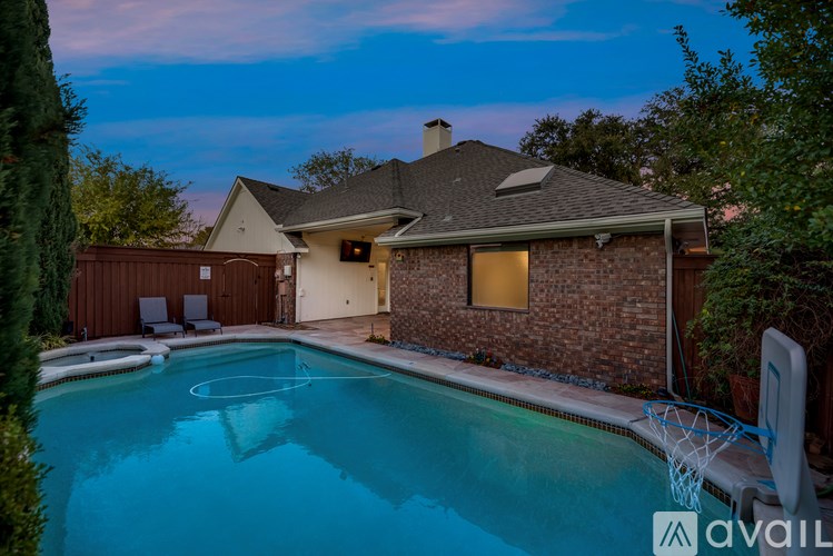 A house with a pool in the backyard.