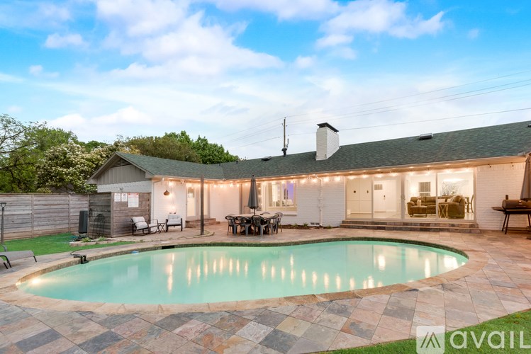A house with a pool in the backyard.
