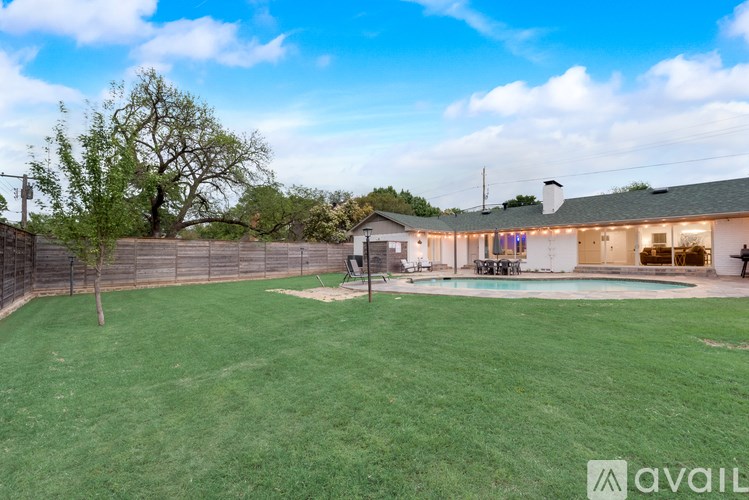 A house with a pool in the backyard.