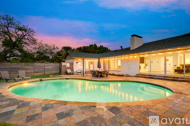 A house with a pool in the backyard.