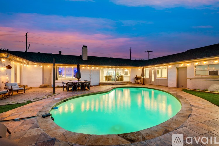 A house with a pool in the backyard.