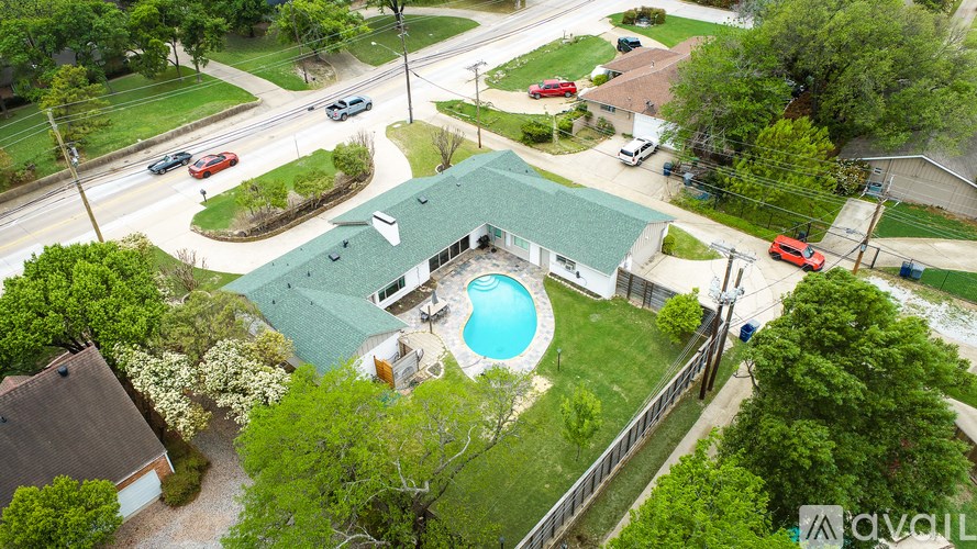 A house with a pool in the backyard.