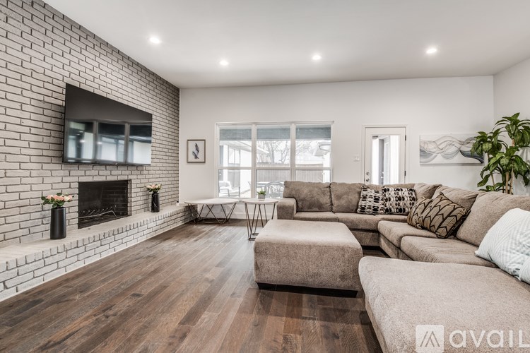 A living room with a fireplace and a couch.