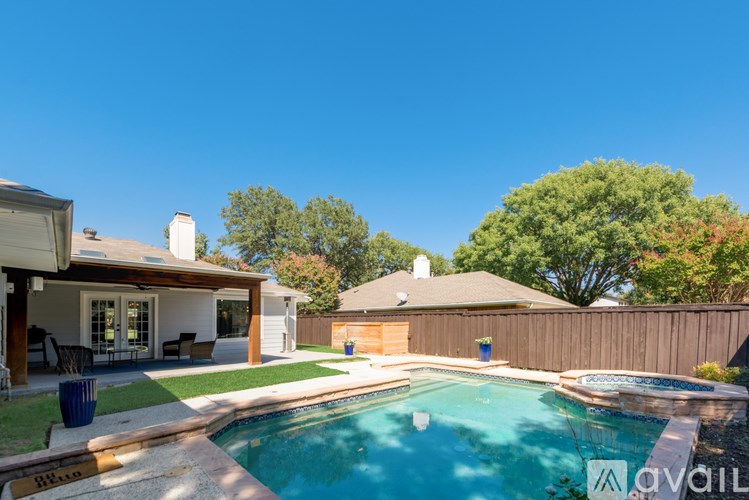 A house with a pool in the backyard.