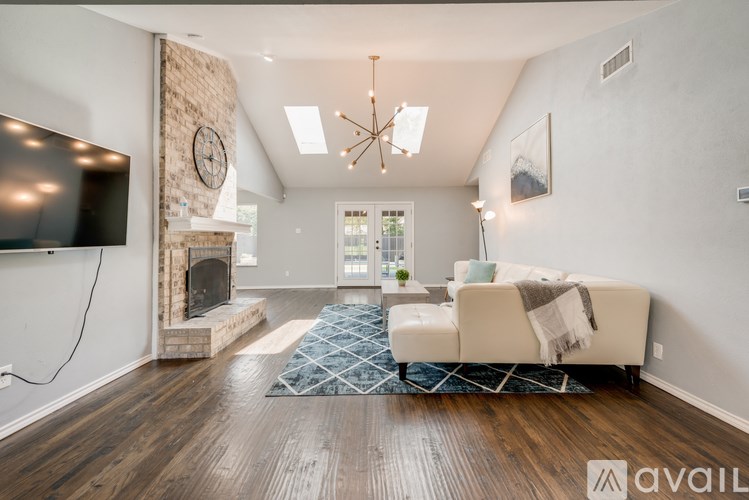 A living room with a fireplace and a couch.
