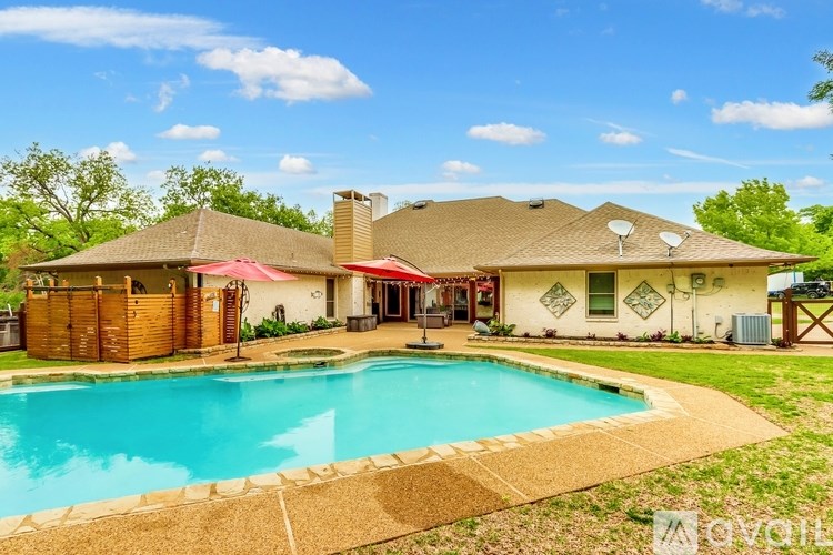 A house with a pool in the backyard.