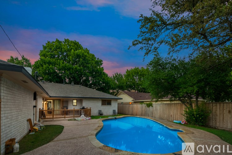 A house with a pool in the backyard.