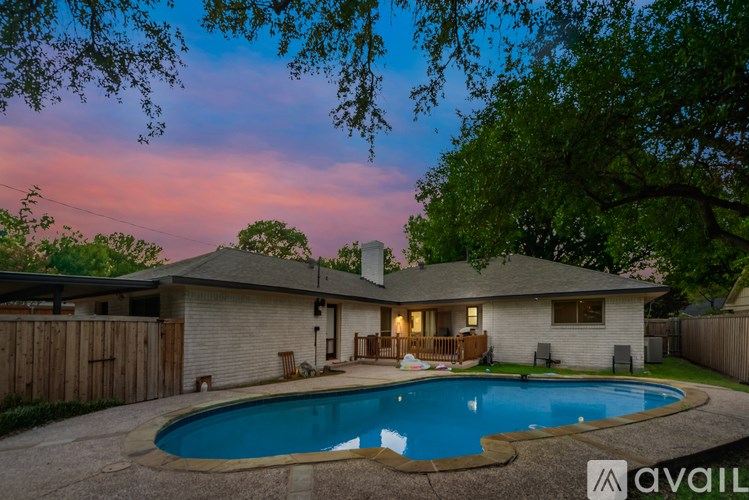 A house with a pool in the backyard.