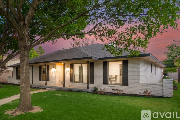 A house with a tree in front of it.