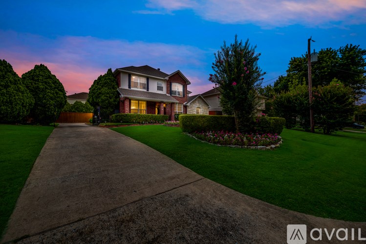 A house with a driveway in front of it is available for sale.