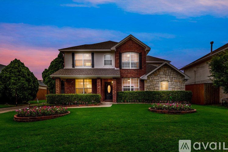 A house with a front yard and a garden.