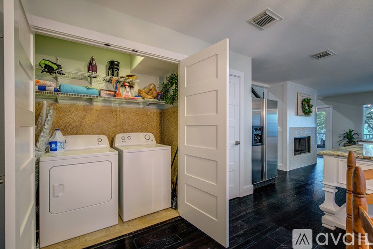 A laundry room with a washer and dryer in it.