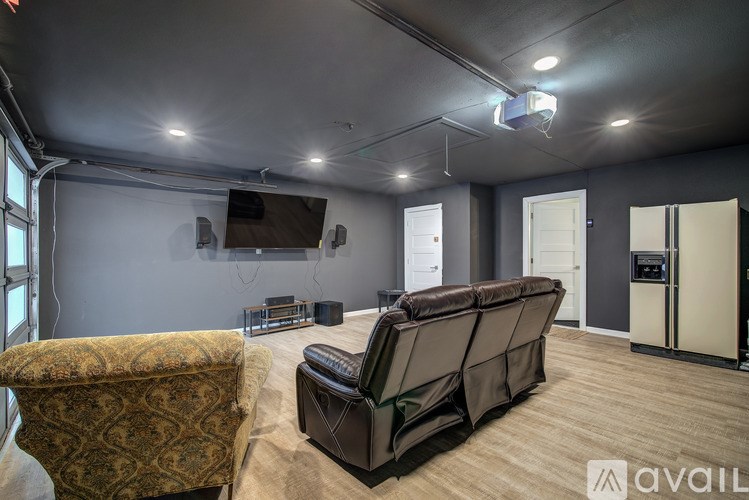 A living room with a sofa and a chair.