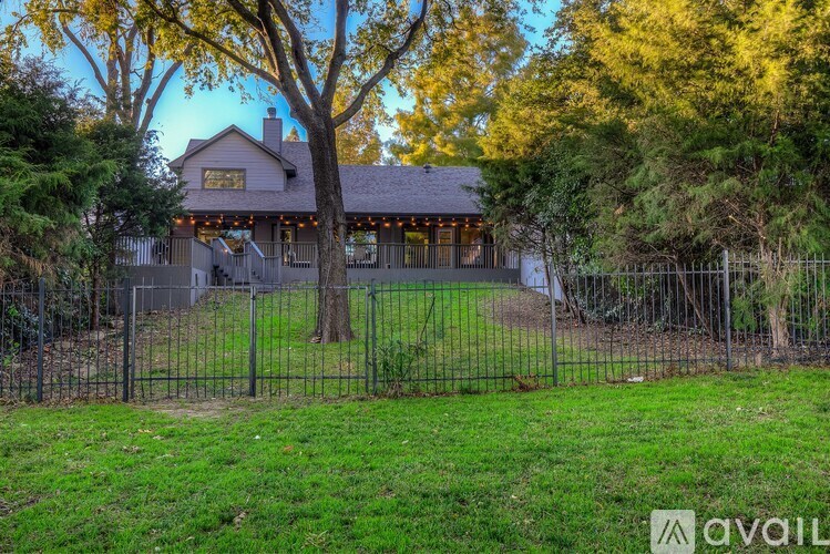 A house with a fence in front of it.