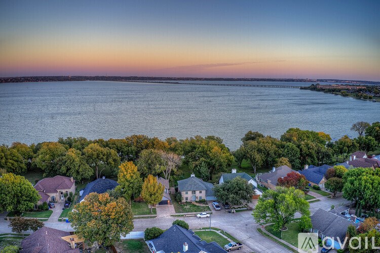A bird's eye view of a residential neighborhood with houses and trees.