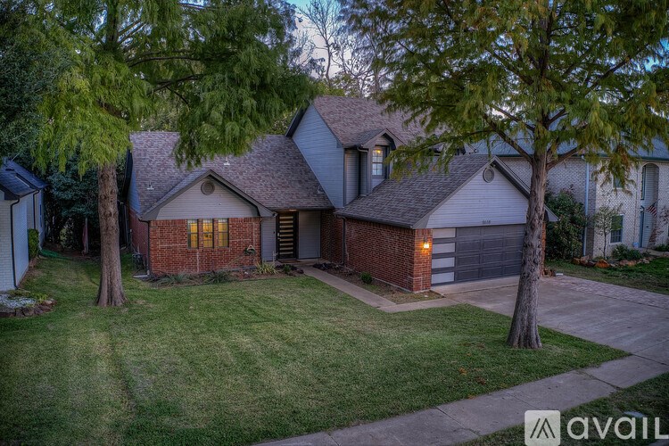 A house with a garage is available for sale.