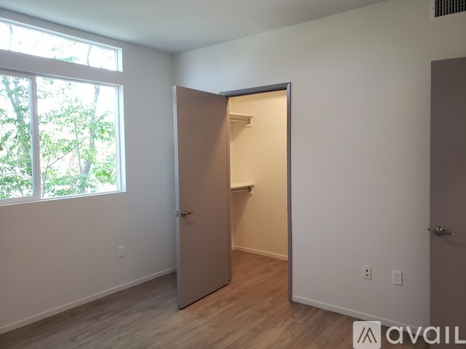 A room with a doorway leading to another room.