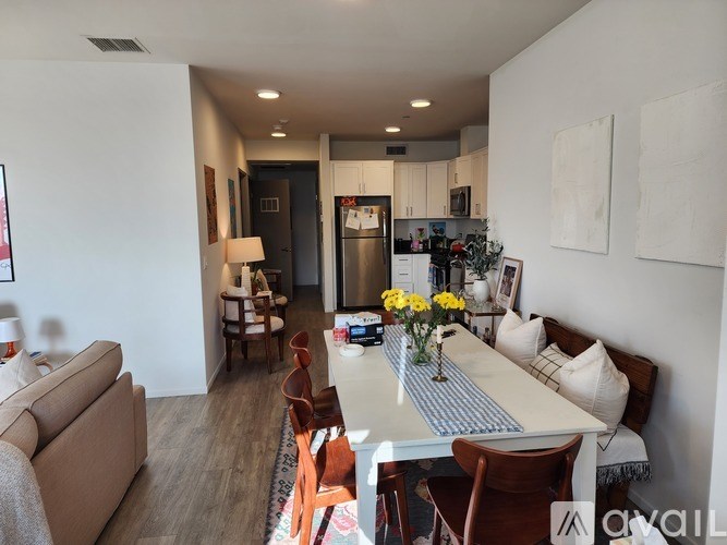 A well-lit dining area with a table set for six.