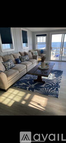A living room with a couch and a coffee table.