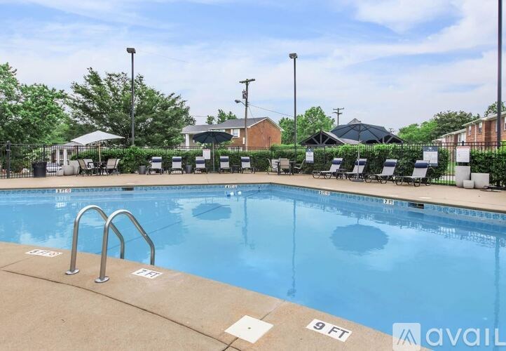 A swimming pool with a depth marker reading 9 feet.