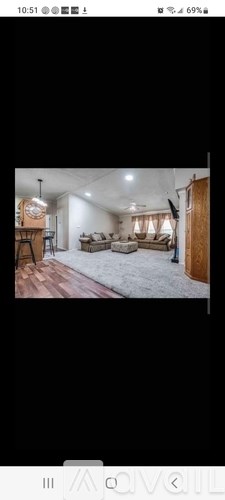 A living room with a couch and a coffee table.
