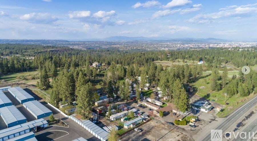 An aerial view of a large industrial area with buildings and a parking lot.