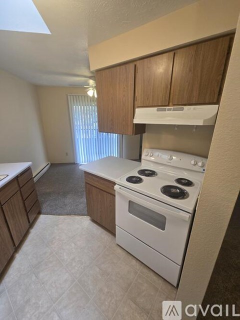 A kitchen with a stove and cabinets.