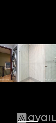 A washing machine is placed in a small room.