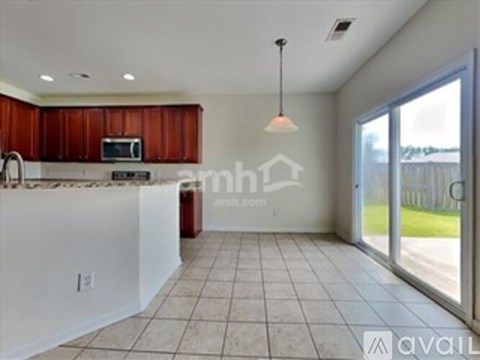 A kitchen with brown cabinets and a white countertop.