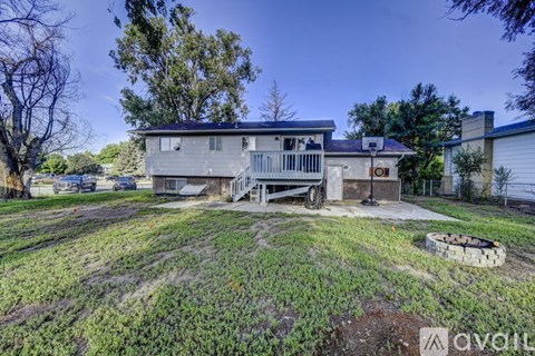 A house with a yard is for sale.