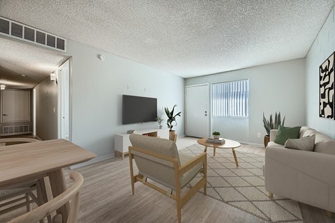 A living room with a wooden table and chairs.