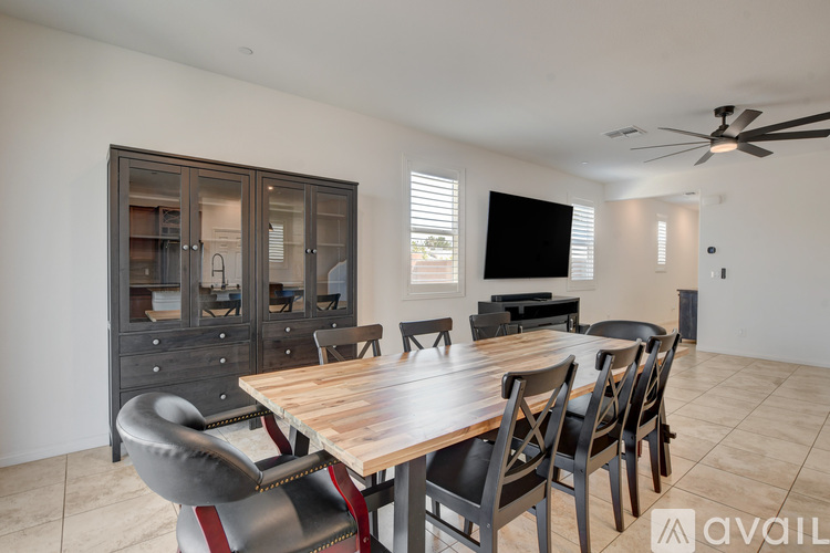 A kitchen with brown cabinets and a granite countertop.