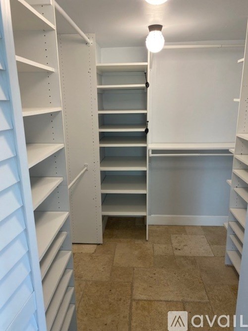 A white shelving unit with a light on.